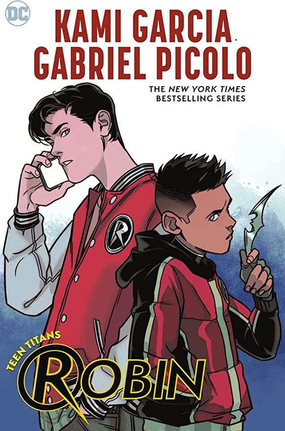 The front cover for Robin by Kami Garcia and Gabriel Picolo. The front cover has a young boy with black hair in the right hand side in a red and black hoodie holding a Batarang. On the left is a taller man with black hair in a red and white baseball jacket with a captial white R on a black circle on the left side.