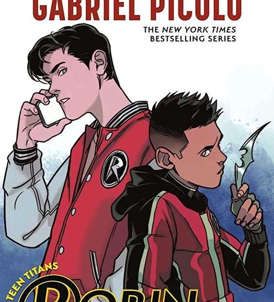 The front cover for Robin by Kami Garcia and Gabriel Picolo. The front cover has a young boy with black hair in the right hand side in a red and black hoodie holding a Batarang. On the left is a taller man with black hair in a red and white baseball jacket with a captial white R on a black circle on the left side.