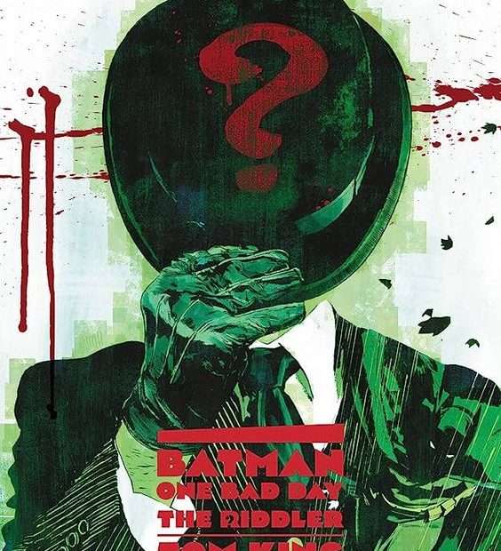 The front cover for Batman - One Bad Day: The Riddler. The Riddler takes up the whole page. His face is covered by his hat which has a red question mark on it. The Joker is shades of green and black except for his white shirt. There are blood splatters on the white wall behind him.