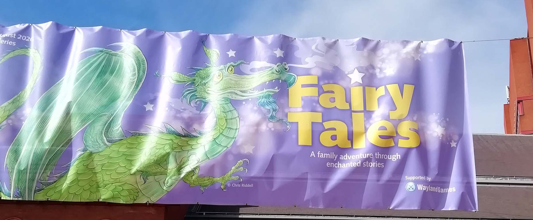Entrance to the British Library with Fairy Tales banner above