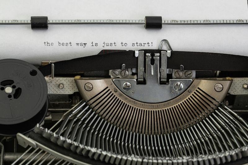 close-up of a typewriter with "the best way is just to start!" typed onto the paper inside