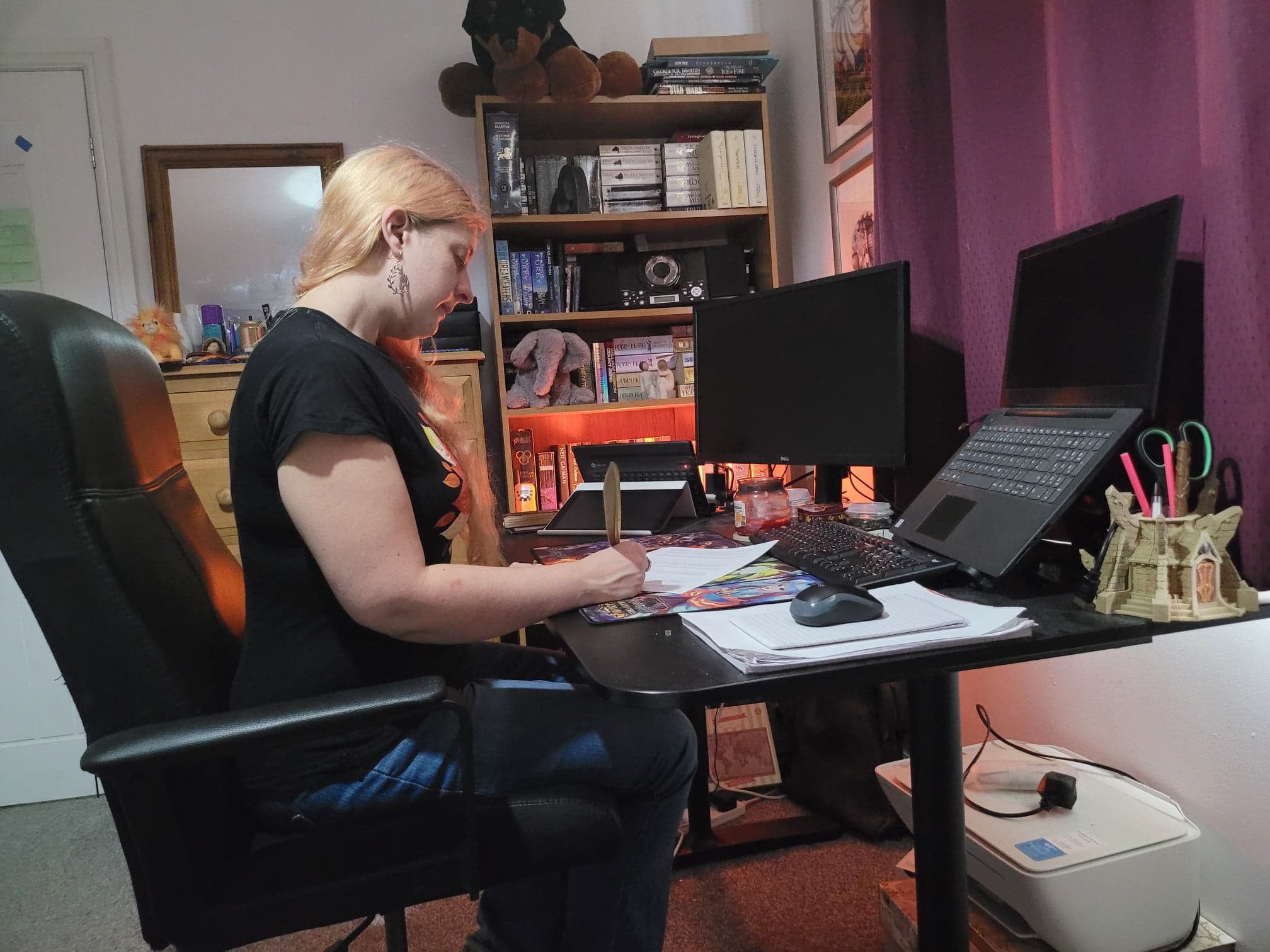 Author Thea Lyons working at her desk