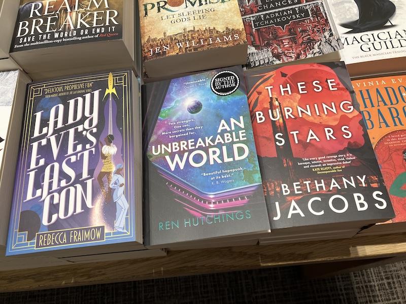 Books sitting in piles on a table