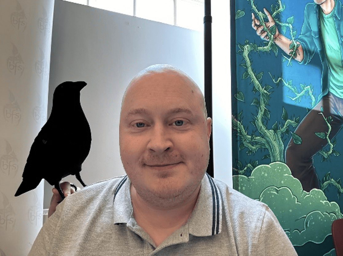Adrian Fletcher with a toy bird on his shoulder