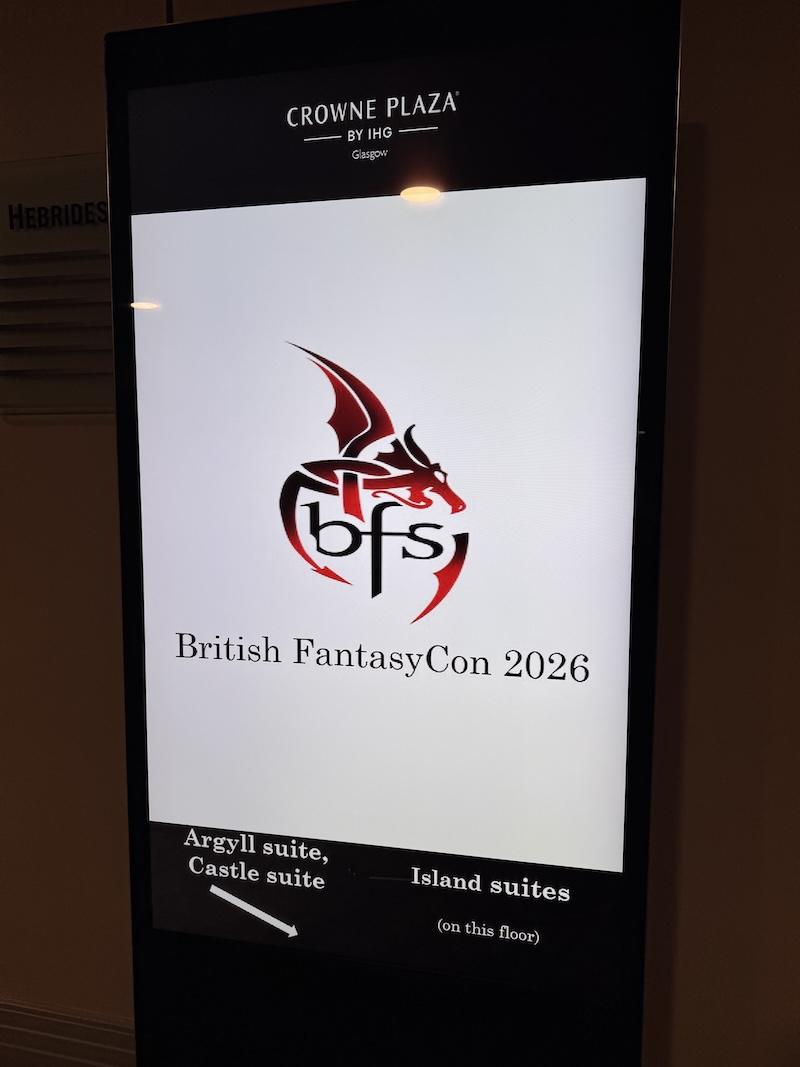 A hotel screen shows the BFS logo and words "British Fantasycon 2026"