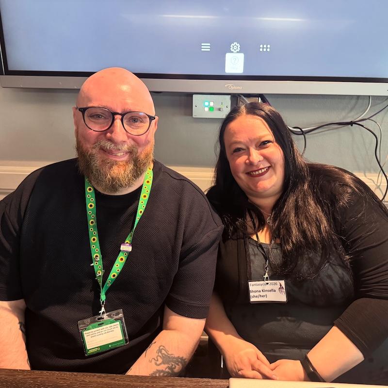 David Green and Shona Kinsella sit at a table at Fantasycon 2026, after the BFS AGM